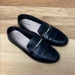 Also black leather loafers with gold accent